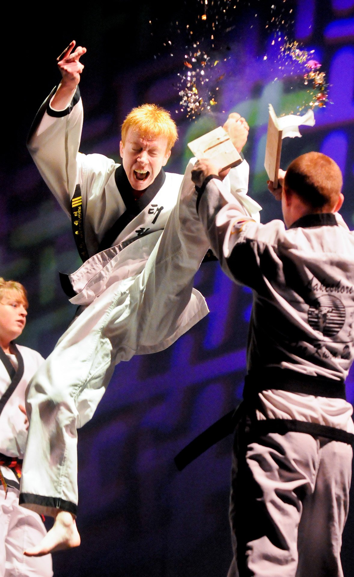 Gavin Wallander of Newton splits a board in mid-air during the Lakeshore Tae Kwon Do Black Belt Spectacular event, which was held recently at the Capitol Civic Centre in Manitowoc.