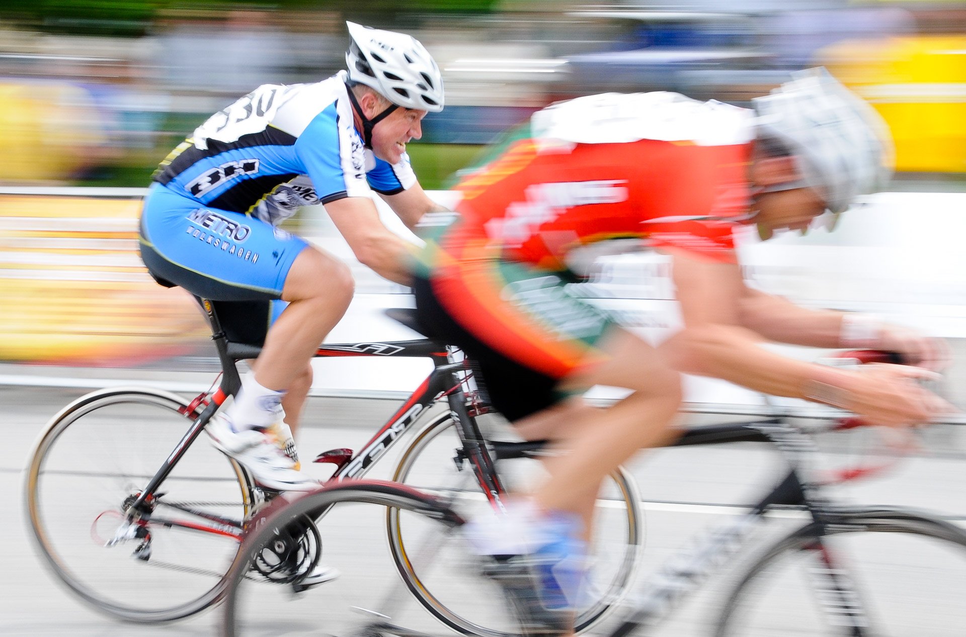 Jay Robertson of Texas tries to pedal past Jim Buckley of De Pere in the last few meters of the Master 4/5 division race during the Maritime Bay Bike Classic on Sunday in downtown Manitowoc. Buckley stayed ahead of Robertson to claim first while Robertson grabbed a close second.