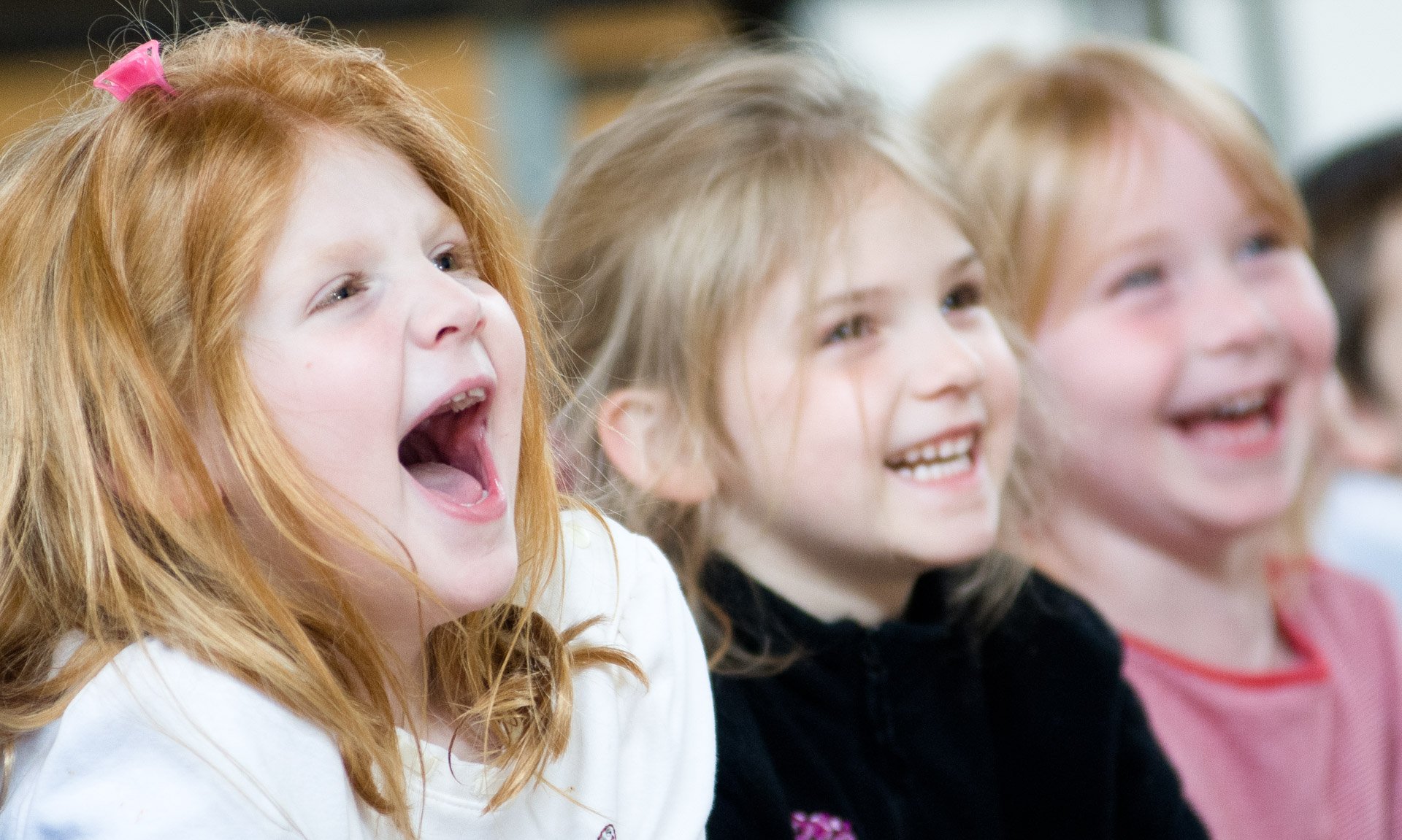 Blakesburg Elementary preschoolers Paige Harter, left, Kaylie Lyon, middle, and Pyton Deevers enjoy Silly Sally the Clown's presentation Tuesday at Blakesburge Elementary School. Silly Sally talked about excercise, eating well and how to do both.
