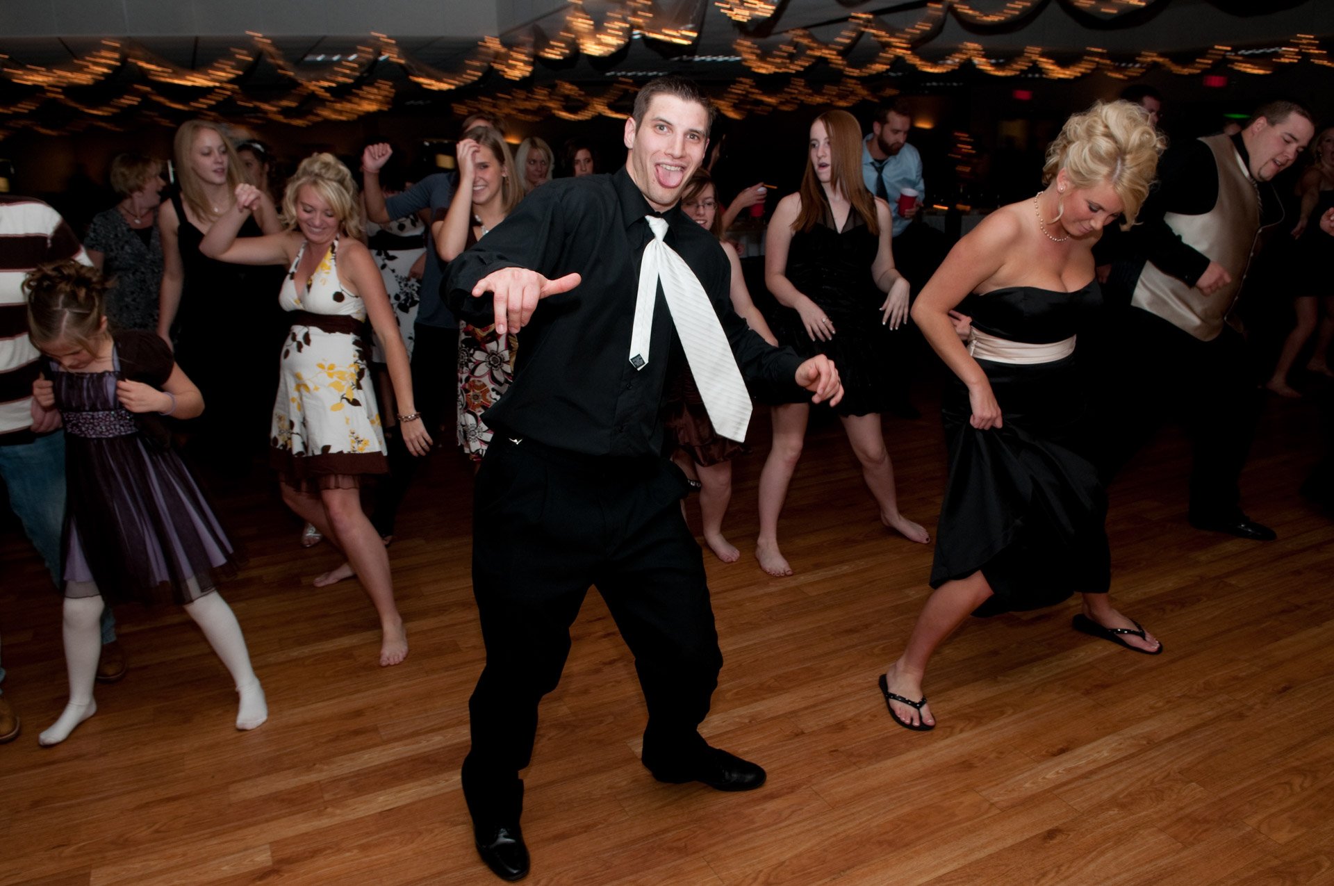 Groom dancing the night away at a wedding.