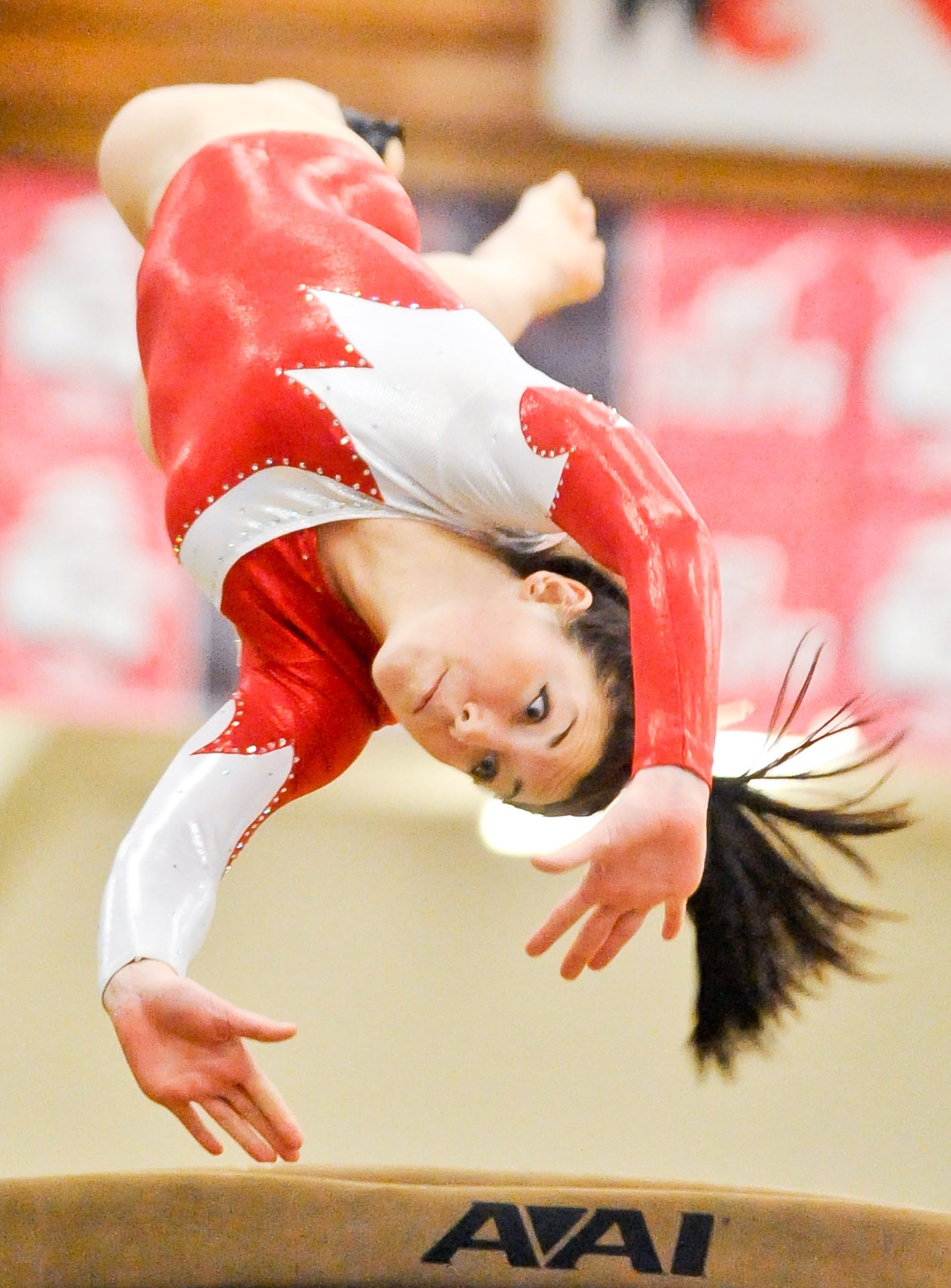 Manitowoc Lincoln's Rachel Loritz completes a flip on the vault during the Manitowoc Holiday Invite gymnastics competition at JFK Fieldhouse on Saturday. Six teams, including Lincoln and Valders, took part in the event.