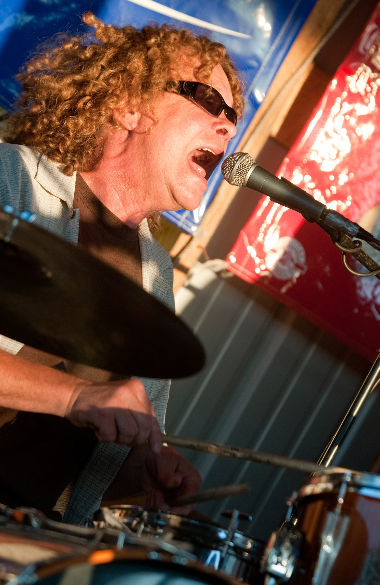 Still rockin' - Drummer and singer Ron Kalista of Clarks Mills sings with the String Benders by the Tiki Boat at Seven Lakes Golf Course July 15 in Cato.